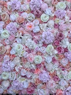 a wall made up of pink and white flowers