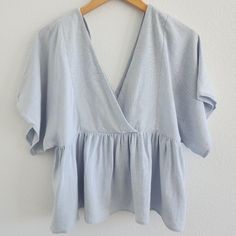 Light Airy Baby Blue Flowy Sleeves Peplum Top - Deep V - Brand New, Never Worn Size 4 Light Blue V-neck Top For Vacation, Light Wash Tops For Summer Brunch, Light Wash Summer Top For Brunch, Blue Flowy V-neck Top, Light Wash V-neck Top For Day Out, Light Blue Flowy Casual Tops, Spring Light Blue Flowy Top, Light Blue V-neck Blouse For Day Out, Chic Light Wash Tops For Beach