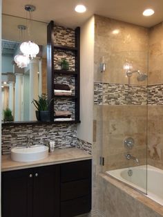 a bath room with a tub a sink and a mirror