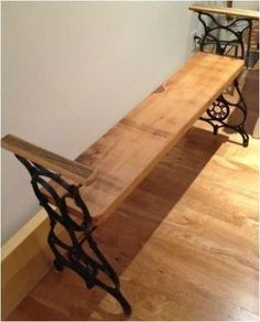 a wooden bench sitting on top of a hard wood floor