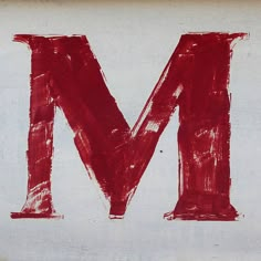 the letter m is painted red and white