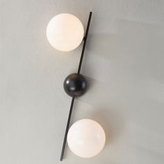 two black and white lights on the wall