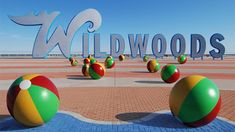 there are many beach balls in front of the words wildwoods on the wall