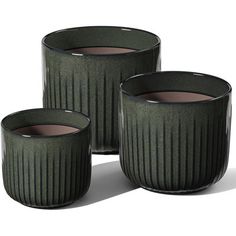 three green vases sitting next to each other