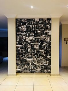 a large wall with many pictures on it in a room that has white tile flooring