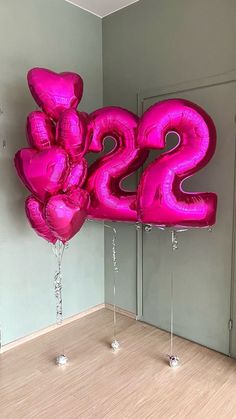 large pink balloon shaped like the number twenty two