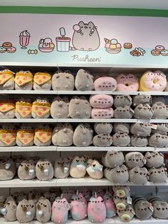 many stuffed animals are on shelves in a store