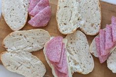 several slices of bread with ham on them