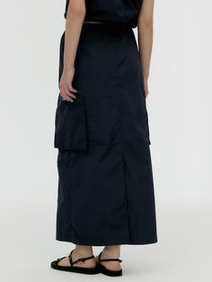 Soft and drapery, this loose fitting skirt features crisp texture, and has trendy wide cargo pockets at sides. Pair yours with any tops for a sporty, casual mood. - Natural, relaxed silhouette- Lightweight nylon fabric- Side zip fastenings- Banded waist with adjustable strings- Slit detail at hem Fitting Skirt, Sporty Casual, Nylon Fabric, Long Skirt, Side Zip, Loose Fitting, Texture, Skirt, Band