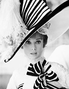 black and white photograph of a woman wearing a hat