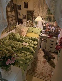 a bed room with a neatly made bed and a dog laying on the floor next to it