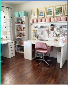 a white desk with pink chair in front of it