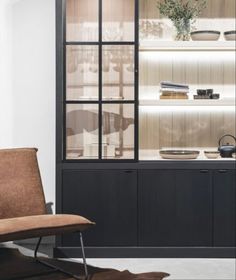 a chair sitting in front of a display case