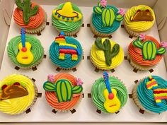 cupcakes decorated with colorful frosting and designs in the shape of cactuses