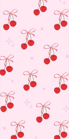 a pink background with cherries and stars