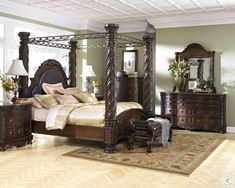 a bedroom scene with focus on the four poster bed