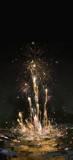 colorful fireworks exploding in the dark sky above water with bubbles and streamers floating around