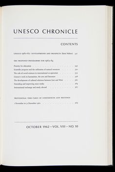 an open book with the title page in black and white, on a black background