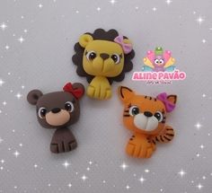 three different animal shaped erasers sitting on top of a white surface with stars in the background