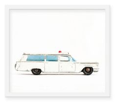 an old white police car with a red light on top is in front of a white background