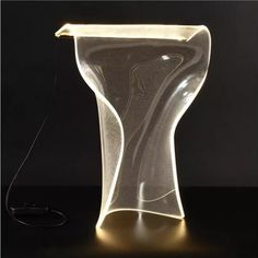 a light that has been placed on top of a table with a wire attached to it