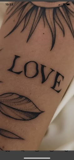 a tattoo with the word love written on it