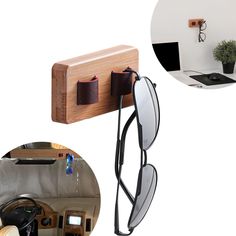 a pair of sunglasses hanging on a wall next to a cell phone and a laptop