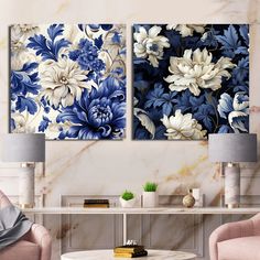 two blue and white floral paintings in a living room