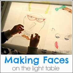 a child is making faces on the light table