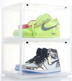 three clear shelves with different types of shoes on top of each other and one has a pair of sneakers in it