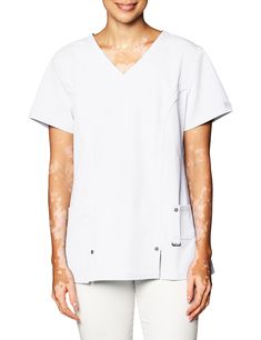 PRICES MAY VARY. Fitted short-sleeve shirt featuring V-neckline with two front vents and decorative grommets at hem Two front pockets Logo tag at sleeve Women Scrubs, Dickies Scrubs, Greys Anatomy Scrubs, Safety Clothing, Logo Tag, Scrub Tops, V Neck Tops, Workout Shorts, White Undershirt