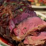 sliced roast beef sitting on top of a plate