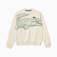 The Oversize Print Croc Sweat from Lacoste is new for the 2023 season. A modern take on a vintage-styled jumper from Lacoste this season that features a large printed croc across the front, rib-knit cuffs and hem, and a crew neck. Crafted with an organic cotton fabric, this jumper is sustainably sourced and is incredibly comfy for everyday wear. A must-have this season from Lacoste, finished with an embroidered signature logo on the front left chest. More Details 100% Cotton Loose fit Rib-knit c 80s Sweatshirt, Croc Print, Jersey Sweatshirt, Printed Joggers, Lacoste Men, Organic Cotton Fabric, Workout Sweatshirt, Printed Sweatshirts, Mens Sweatshirts