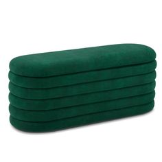 six green pillows stacked on top of each other