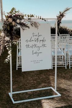 an outdoor ceremony with white chairs and a sign that says, true love is made of pride