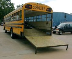 a school bus with its door open in a parking lot