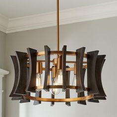 a wooden chandelier hanging from the ceiling