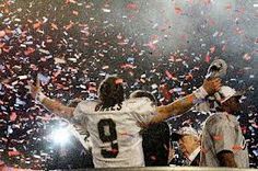 the football players are celebrating with confetti