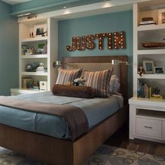 a bed room with a neatly made bed and shelves