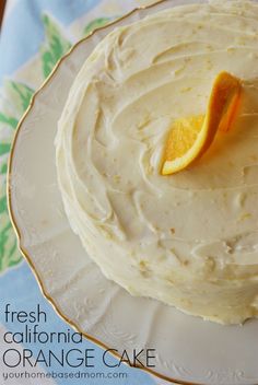 a white cake with orange slices on top