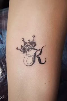 a tattoo with a crown on it