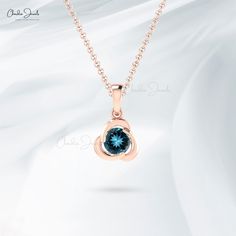 Description Elevate her elegance with our Solid 14k Gold London Blue Topaz Pendant. This 7mm round gemstone, encased in a twisted design, combines timeless sophistication with a unique flair. Perfect for any occasion, this pendant highlights the mesmerizing December birthstone, making it an exquisite gift for her. The gold chain shown in pictures is just for reference and display purpose, in order pendant comes with a COMPLIMENTARY 925 SILVER CHAIN. Product Details SKU CJ P 1439 LBT Product dime Dimension 20, Blue Topaz Pendant, Topaz Pendant, Solitaire Pendant, December Birthstone, London Blue Topaz, Topaz Gemstone, London Blue, Stone Settings