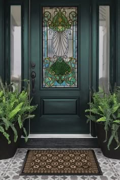 a green front door with potted plants next to it and a stained glass window