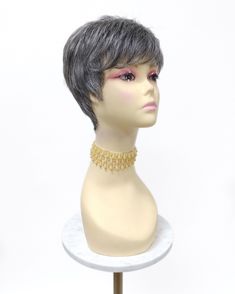 "Short layered pixie cut wig with bangs. Inside cap has adjustable elastic straps, no combs or clips. Color: Salt and Pepper Gray (44) Circumference: Default at 21\" with adjustable cap (max 23\") Materials: Synthetic Wig Fibers All sales are final. Please read all store policies before purchasing." Layered Wig With Bangs, Short Layered Pixie, Gray Pixie, Layered Pixie Cut, Pixie Cut Short, Layered Pixie, Layered Wig, White Wig, Short Layers