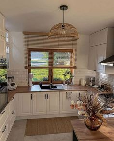 a kitchen filled with lots of counter top space next to a stove top oven and microwave