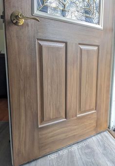 a close up of a wooden door with a glass pane on the top and bottom