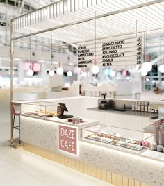 the interior of a deli restaurant with an open counter and food items on display