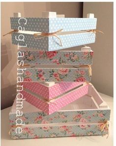 four boxes stacked on top of each other with bows and polka dots in the middle