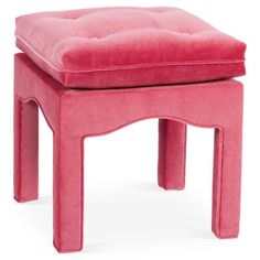 a pink stool with a foot rest on it