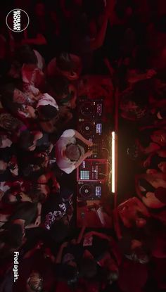 an overhead view of a dj mixing at a concert